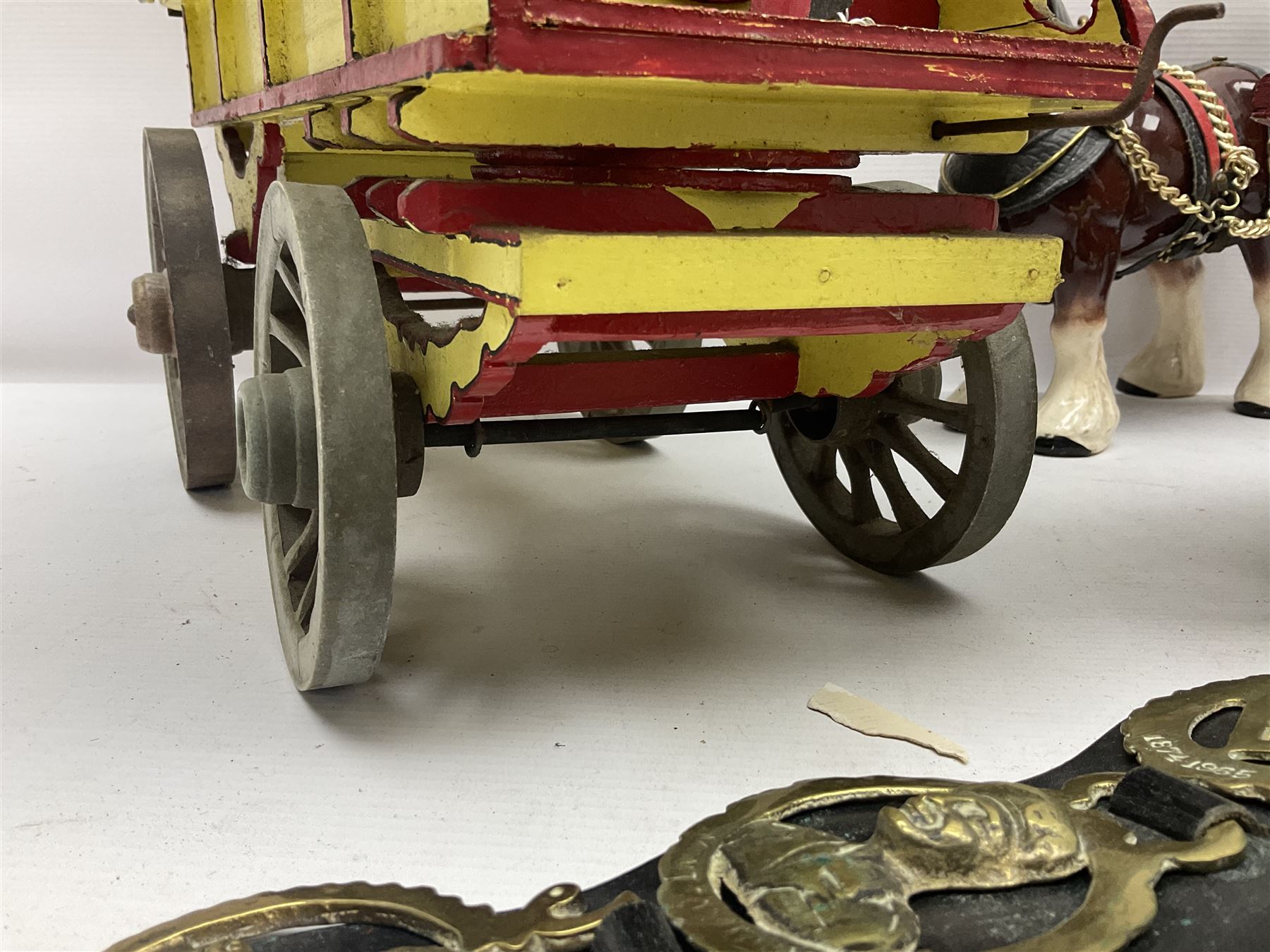 Two ceramic shire horse and gypsy caravans, together with horse brasses 
