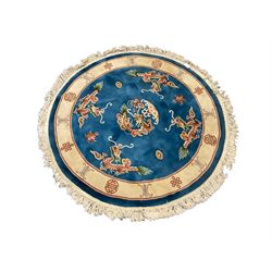 Three Chinese washed woollen rugs - circular blue ground decorated with dragons (D160cm), rectangular light green rug (185cm x 123cm), and a rectangular green rug (185cm x 123cm)