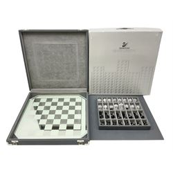 Swarovski silver crystal cut glass chess set, with clear and black pieces on mirrored board, in original presentation box 