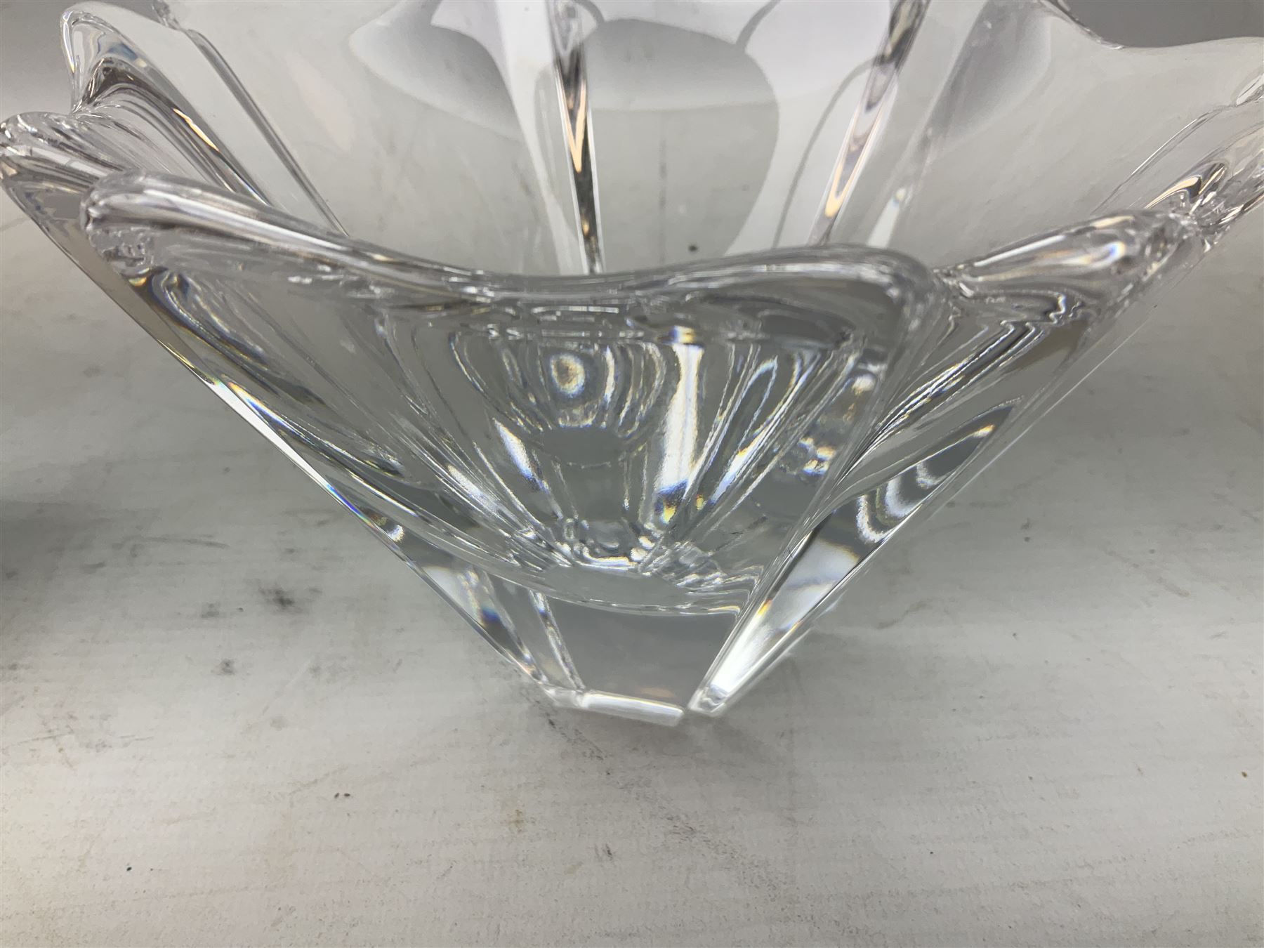 Two Orrefors Art Glass clear glass vases, the first example of compressed circular form, the second of tapering form with lobed rim, each signed beneath, tallest H14.5cm