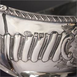 Victorian silver sauce boat engraved with a monogram Sheffield 1892 Maker John Round  & Son Ltd, another with crimped rim Birmingham 1912 Maker Elkington & Co, two silver pepperettes and a small silver challenge cup