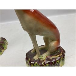 Pair of Staffordshire style seated greyhounds, H20cm