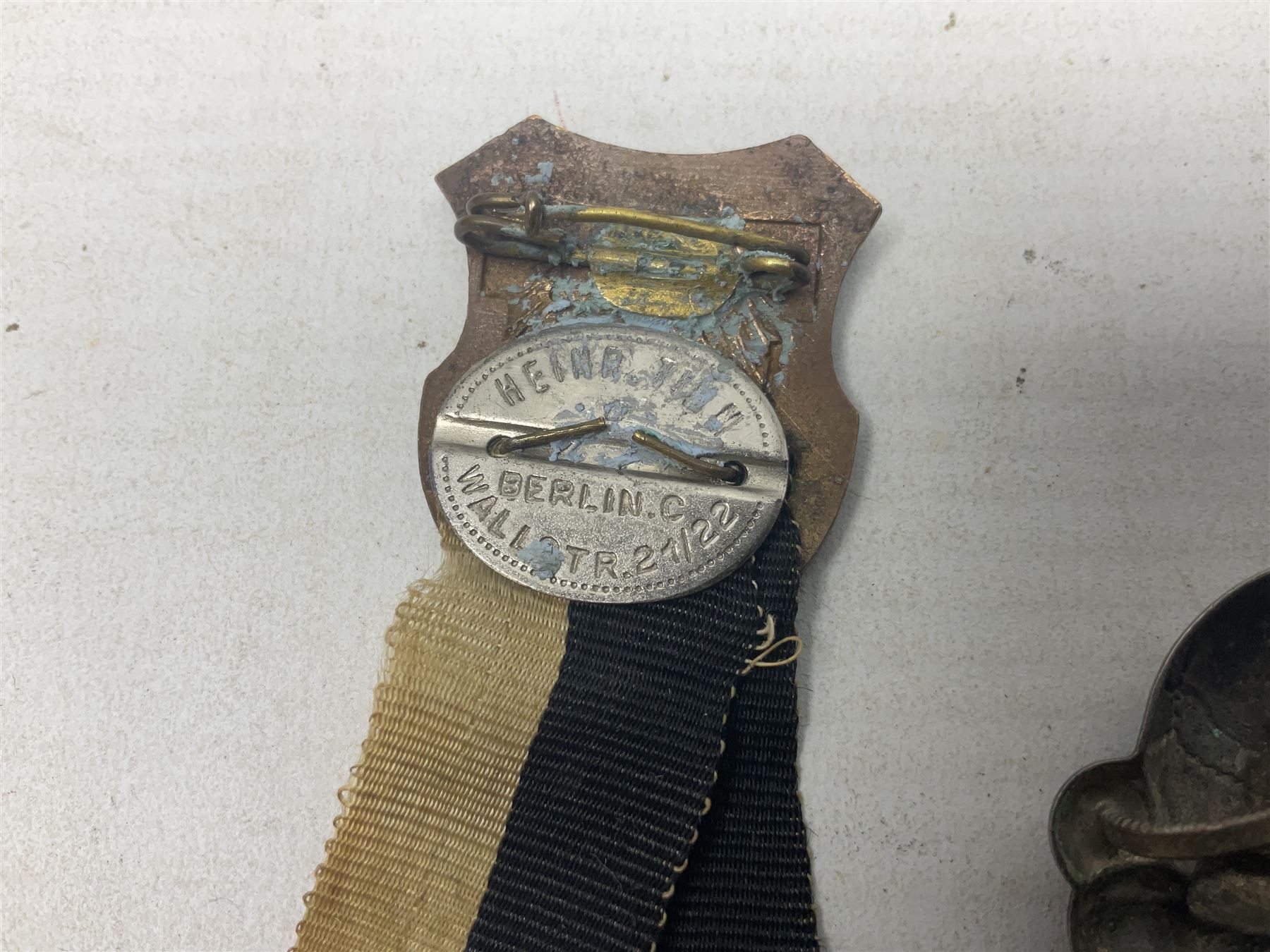 Imperial German Prussian Army Service Veterens Association badge; 'SS' type first pattern cap skull; Luftwaffe metal eagle uniform insignia; and another metal eagle cap insignia (possibly police?) (4)