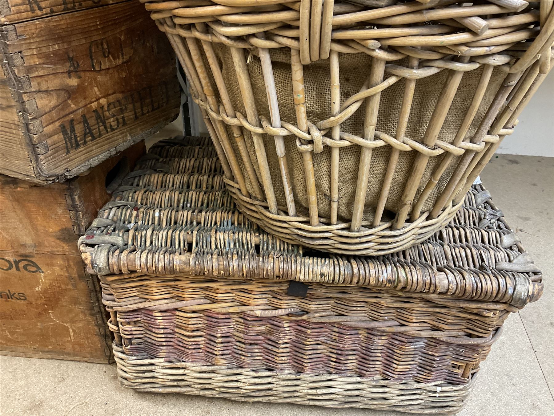 Two wicker baskets, three pine lidded bottle crates with quantity of glass bottles, comprising one with R.L. June & Co Ltd Mansfield black lettering and pair detailed Mandora Soft Drinks, Mappin & Webb blue cardboard box and framed With the Colours Punch 1924 print, larger basket W60cm