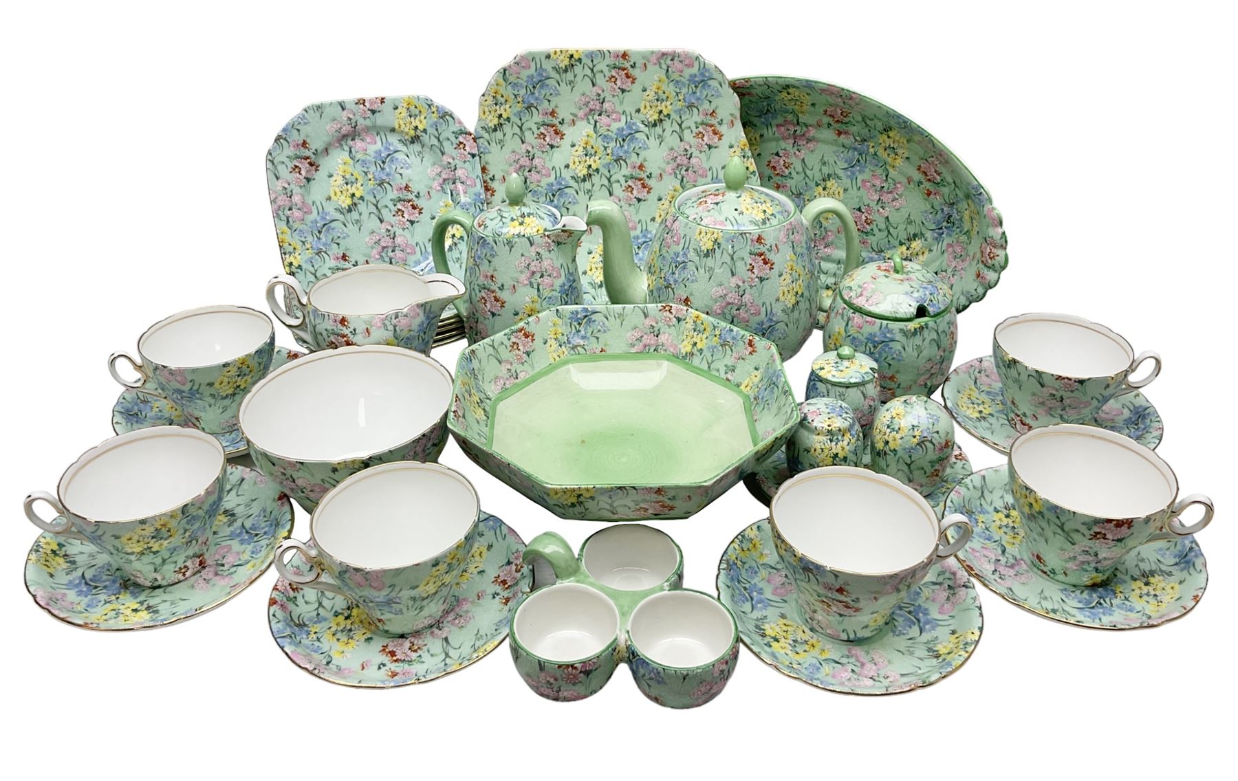 Shelley Melody pattern tea service for six, to include teapot, teapot stand, hot water jug, milk jug, covered sucrier, teacups and saucers, cake plates etc (31)