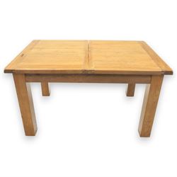 Contemporary oak extending dining table, moulded rectangular top with visible grain and inset extension leaf, pull out extending mechanism, standing on four square legs, accompanied by a set of high slat back chairs with upholstered brown faux leather seats and square tapering supports joined by stretchers