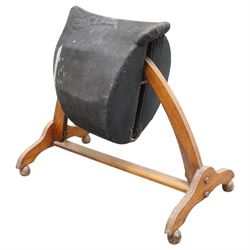 Carlton's - early 20th century weight bearing saddle stand, the top part allowing for the movement of the saddle, on curved oak trestle, marked Carlton's Registered