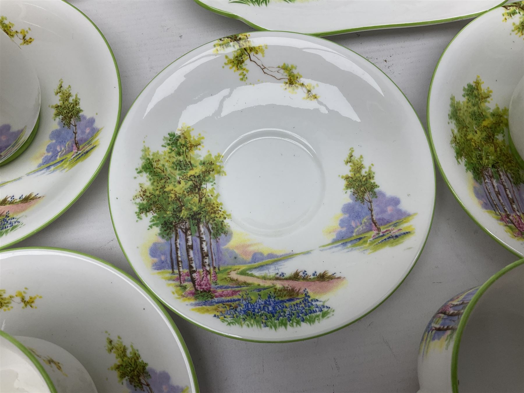 Aynsley Bluebell Time 'As Supplied to the Queen' tea service, comprising hot water jug, six teacups and saucers, milk jug, two cake plates and tow trinket dishes  