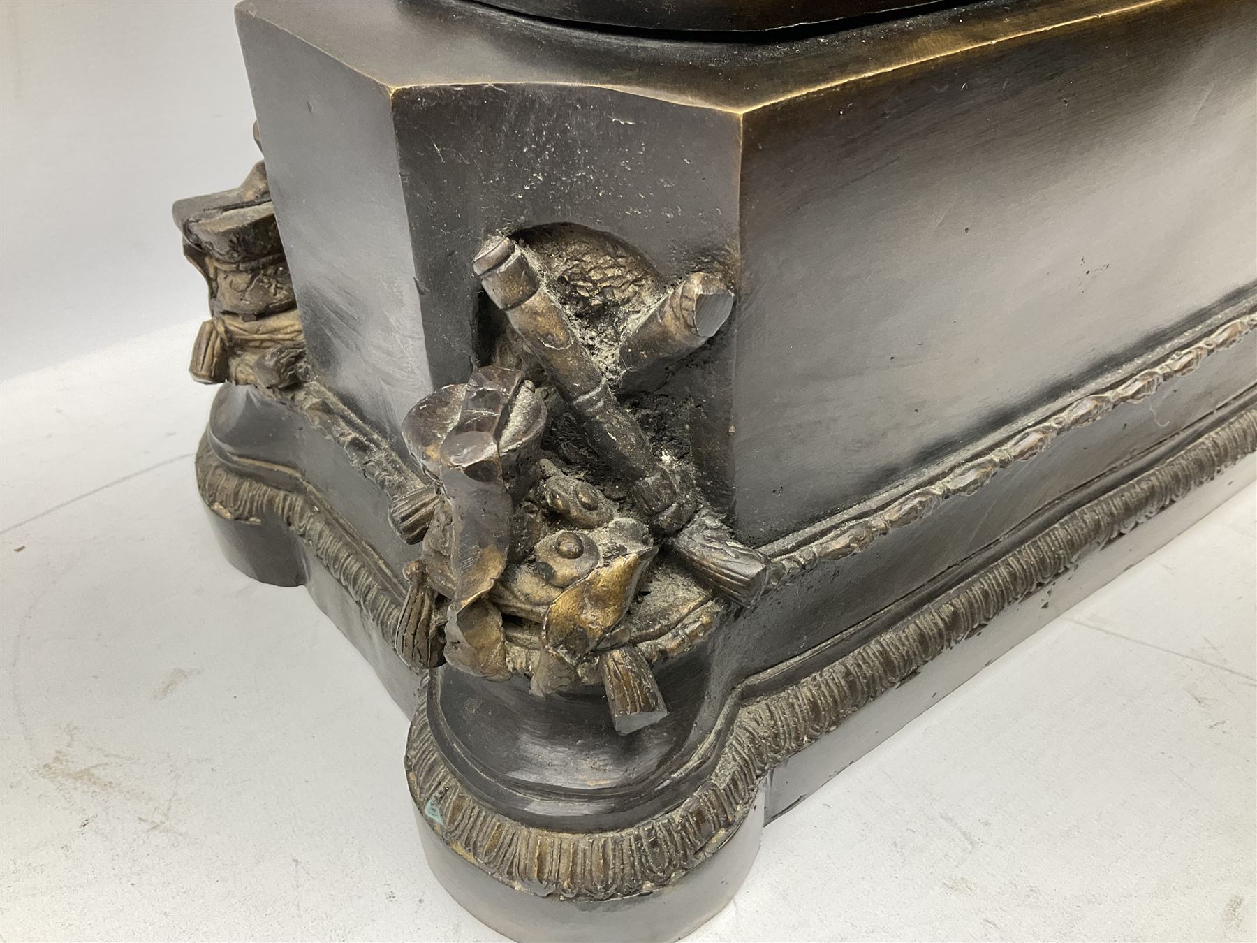 Large and impressive bronze figure of Wellington seated on a horse, on a sarcophogus shaped stepped base impressed 'Meunier Paris', the canted corners inset with battle trophies H68cm L50cm D22cm