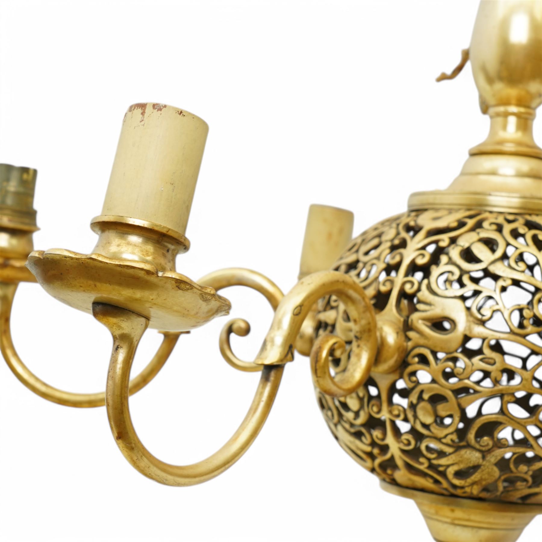 Art Nouveau pierced globe and six branch chandelier, each scrolled branch holding a single candle-style bulb holder and fitted bobeche, with four matching sconces, chandelier H55cm