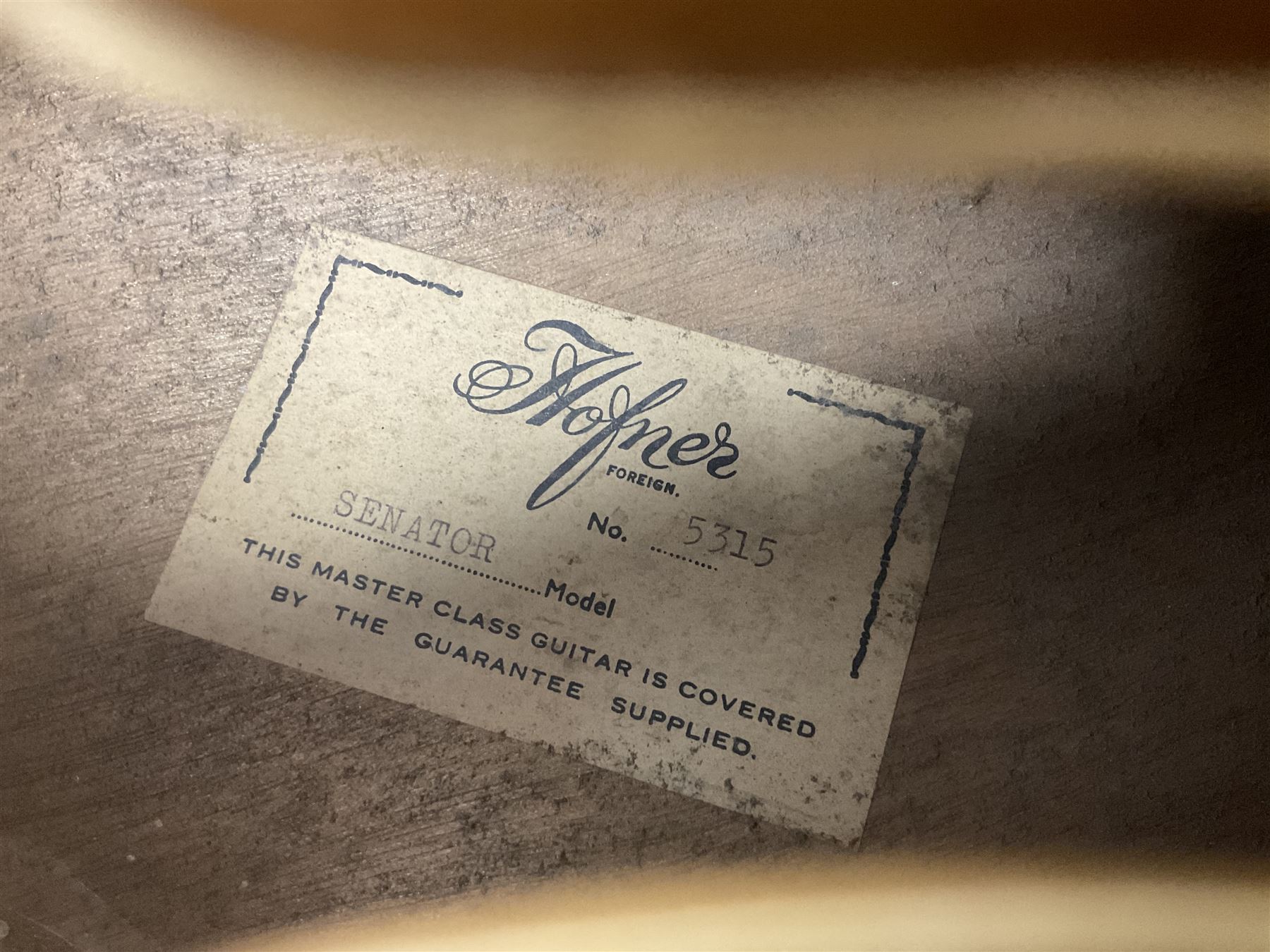 1958 Hofner Senator acoustic guitar with two-tone finish and Hofner label bearing serial no.5315, L104cm overall; in soft carrying case.