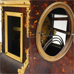 French-late 19th century brown stained 8-day faux Tortoise shell and ormolu mounted mantle clock, rectangular case with glazed side panels and shaped pediment with matching finials, convex enamel dial with Roman numerals, minute track and steel moon hands within a cast brass glazed dial bezel,
twin barrel movement with rack striking, striking the hours and half hour on a coiled gong. With pendulum and key.