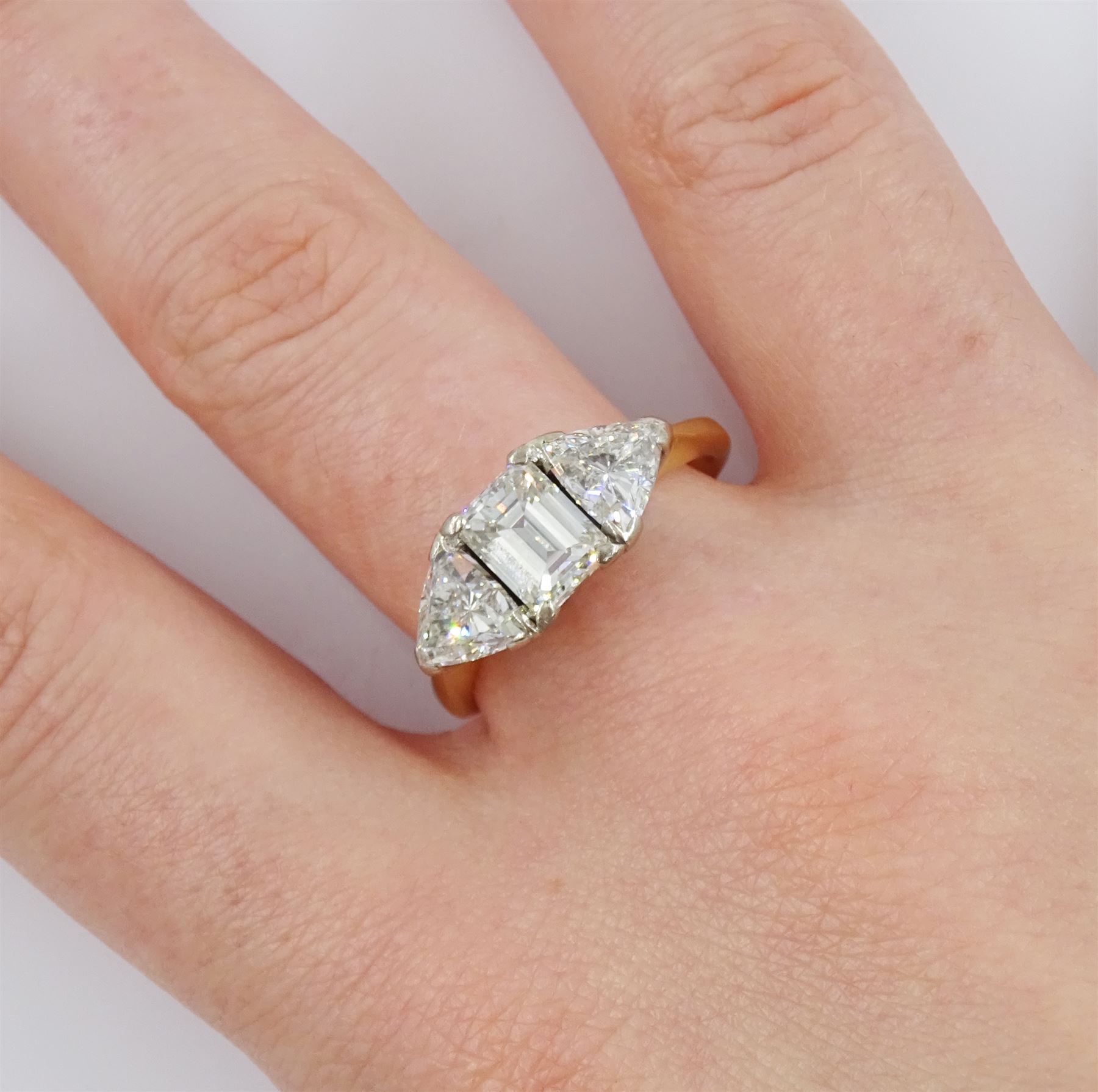 18ct gold three stone emerald cut and trillion cut diamond ring, Birmingham 1998, principal diamond approx 1.15 carat, each trillion cut diamond approx 0.80 carat, total diamond weight approx 2.75 carat