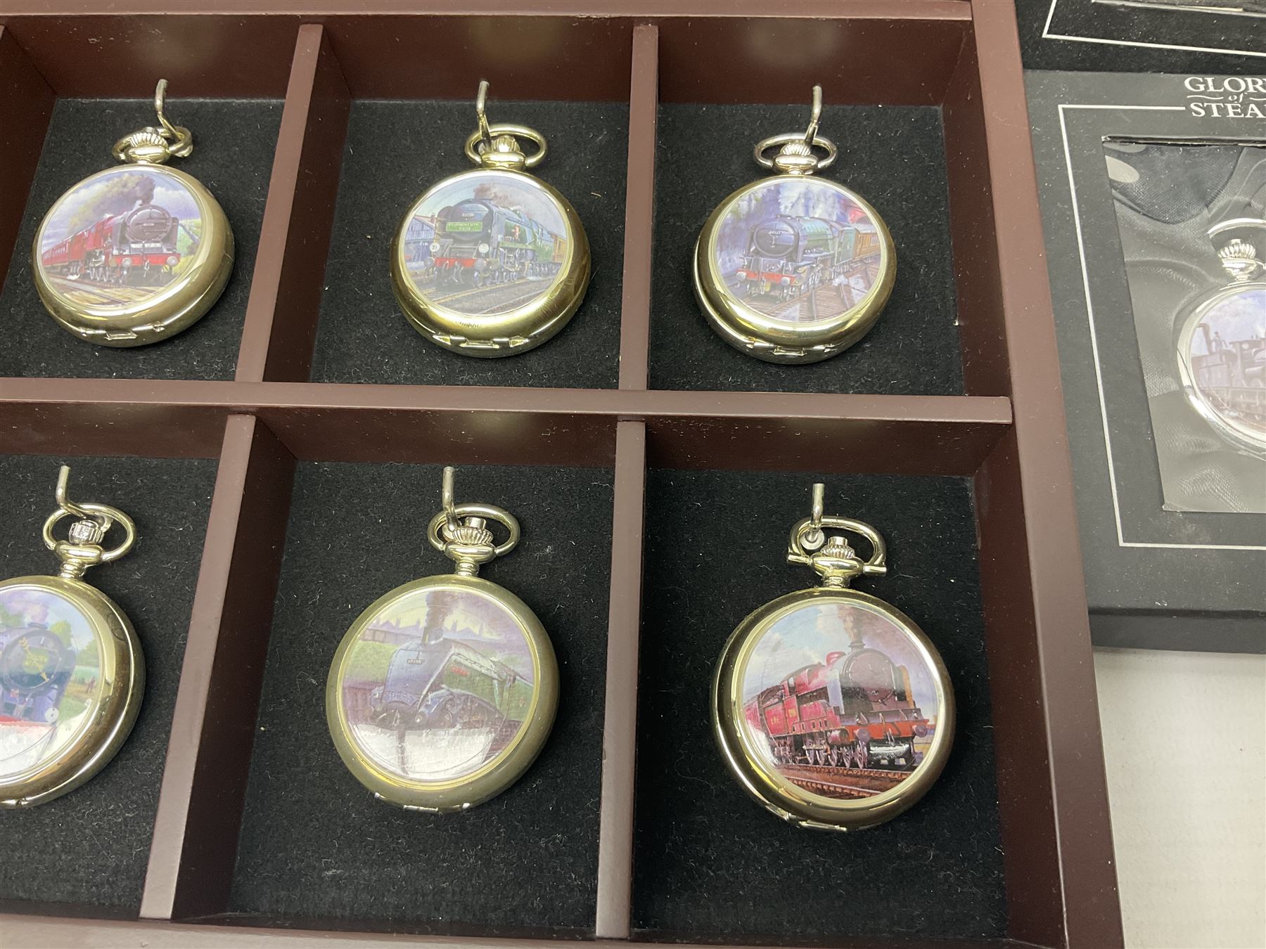 Twenty-three Glory of Steam Atlas Editions silver plated pocket watches, to include The Scottish Horse, Merchant Navy Class, etc, with wood display case, all boxed, twenty one with certificates