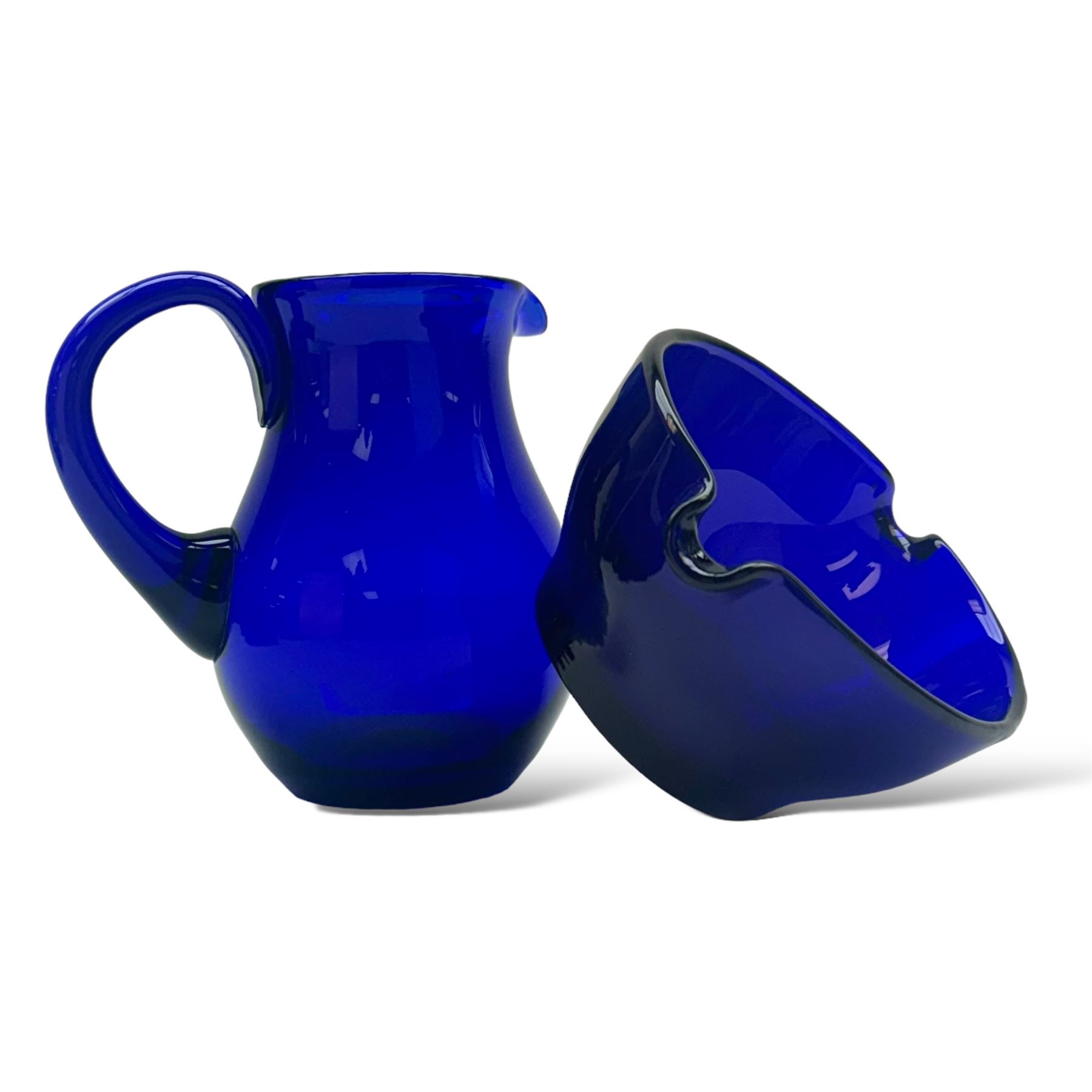 19th century Bristol blue glass jug, the baluster body with simple loop handle, together with a double lipped rinser, jug H14cm