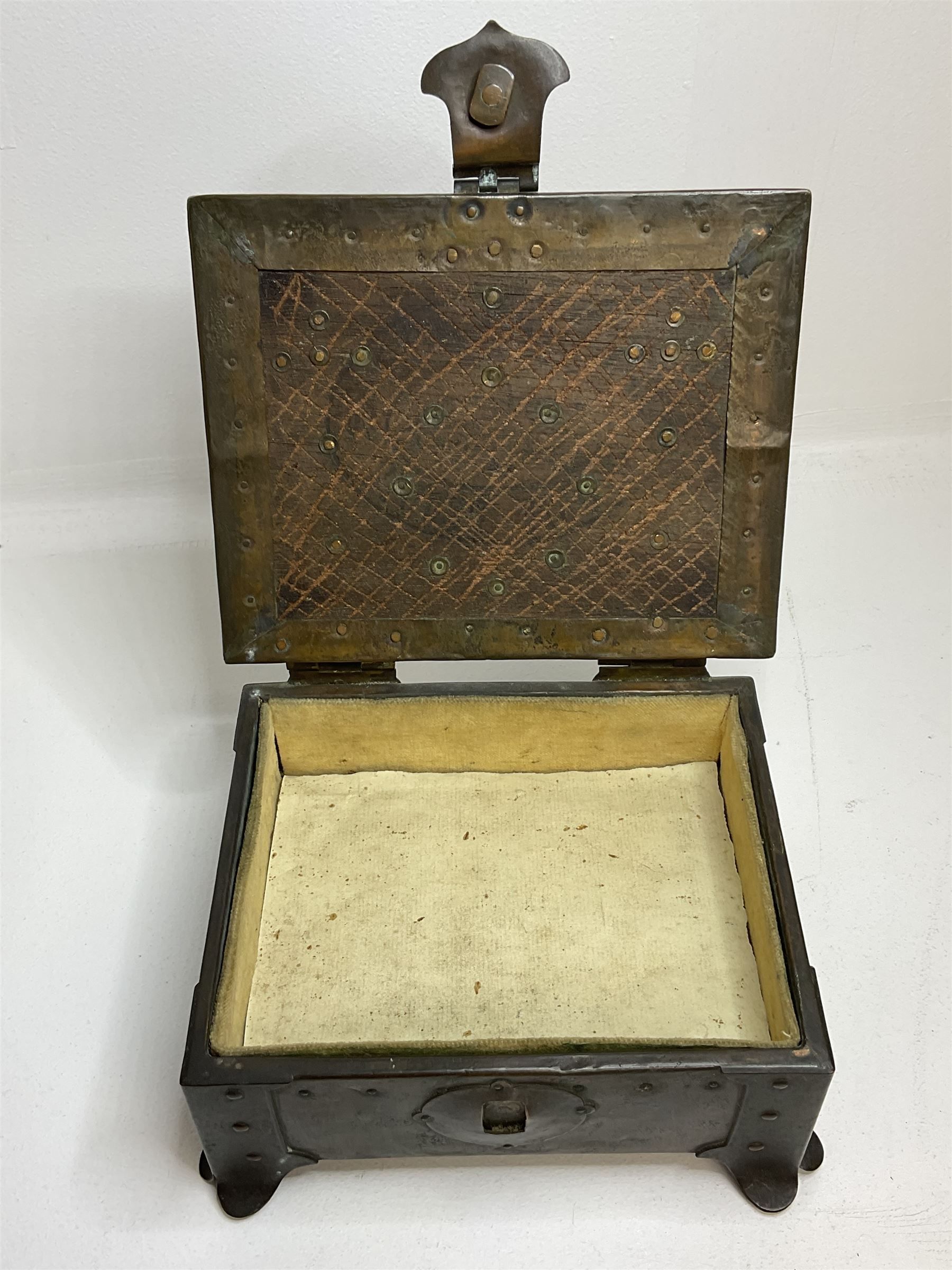 Arts and Crafts copper box, the lid decorated with stylised riveted hinges and inset with Ruskin type ceramic turquoise heart-shaped cabochon, the mount etched M.B 1913, and further cabochon roundel to each side panel, including one inset to the clasp acting as the knob to the locking mechanism, marked RS Douglas 1913 beneath, W16.5cm H7cm D15cm