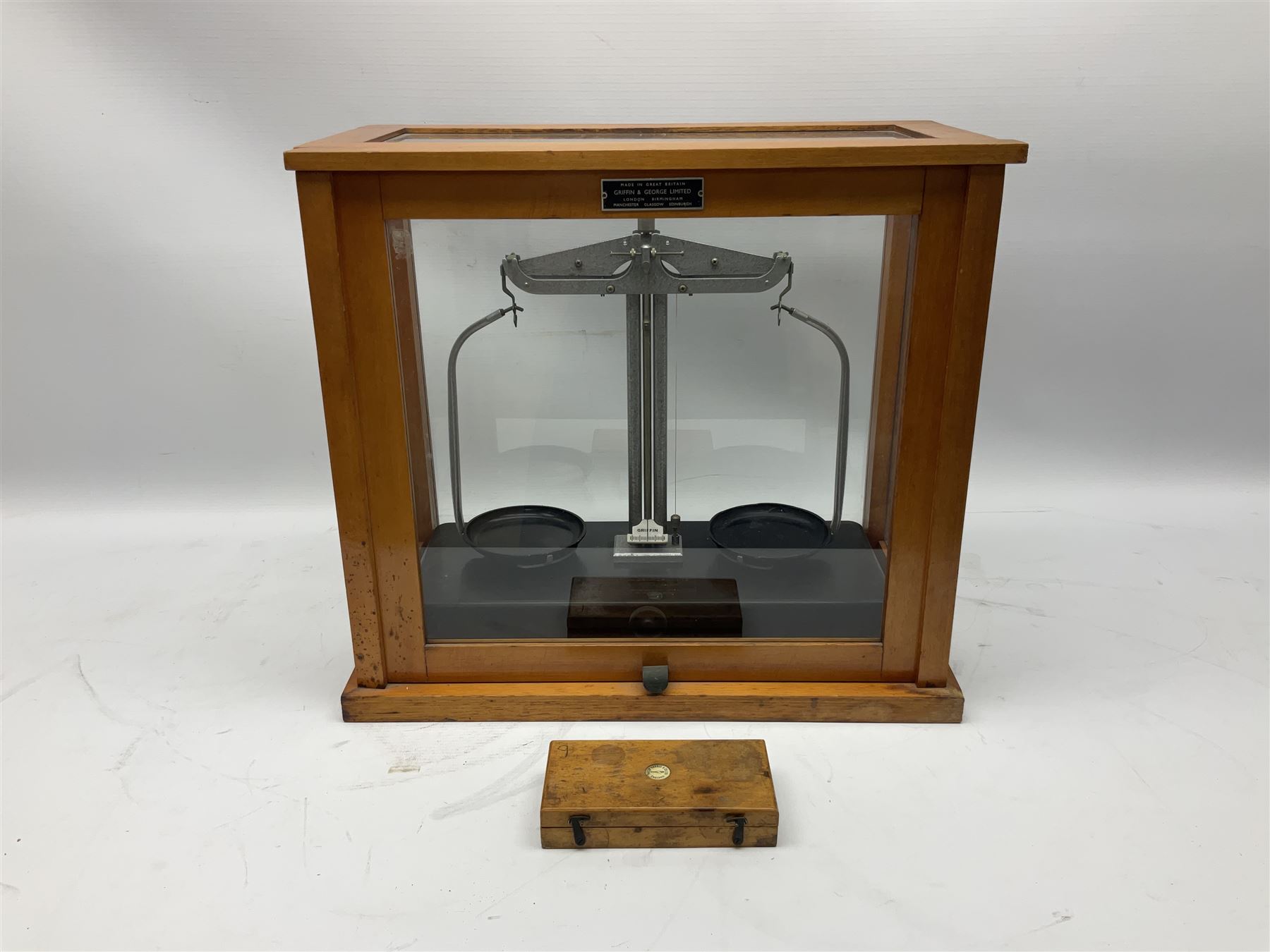 Griffin & George set of laboratory scales in fully glazed hardwood cabinet with rise-and-fall front door L44.5cm H40cm; with beech box of brass weights by Philip Harris & Co Ltd