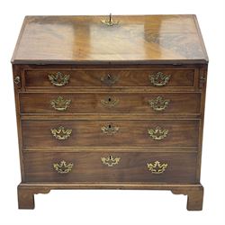 George III mahogany bureau, fall-front enclosing a fitted interior of drawers, pigeonholes and central mirrored cupboard, over four graduated cockbeaded drawers with brass batwing handles, raised on bracket feet