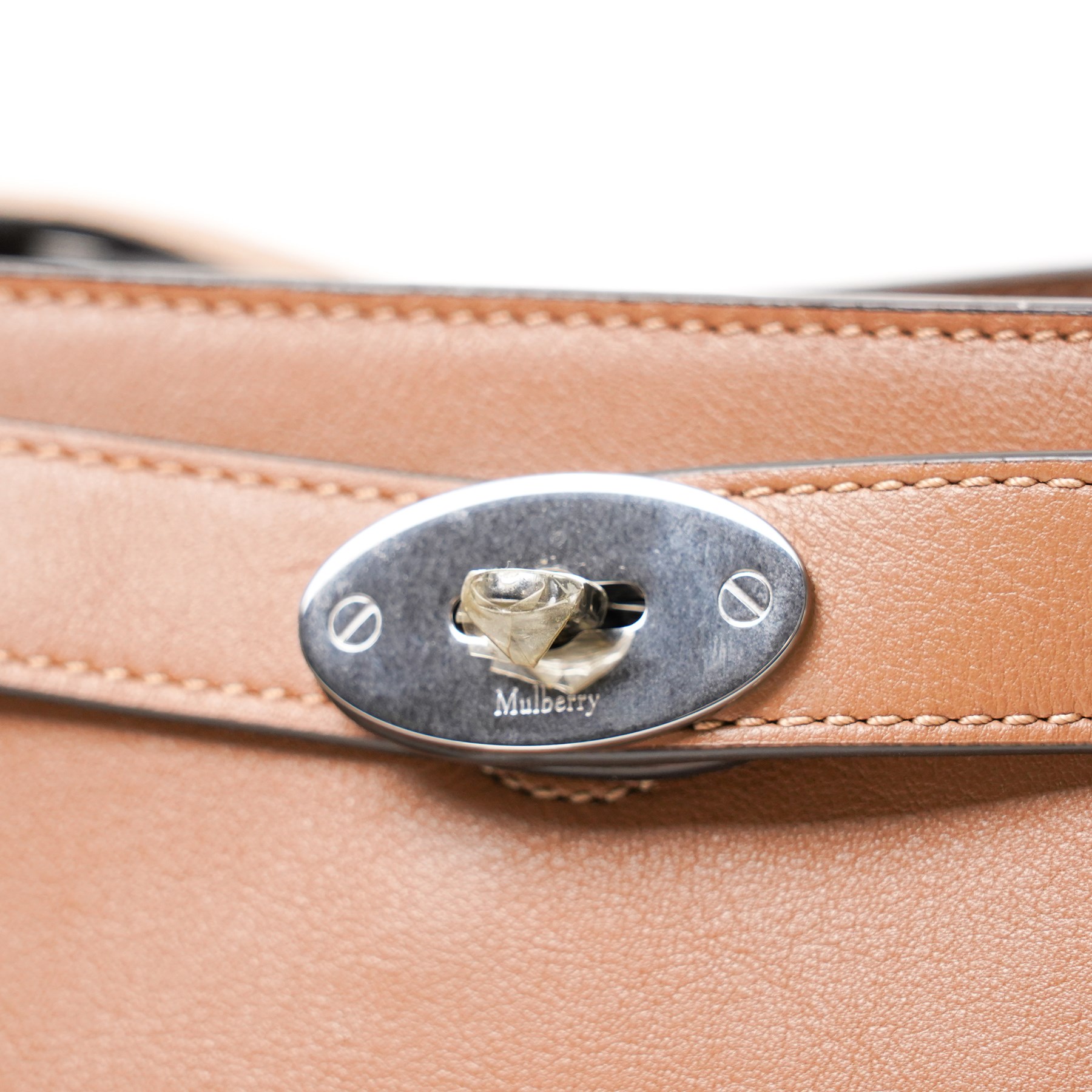 Mulberry - Islington handbag in Teak Silky Calf leather with black piping, the structured body with single rolled top handle, gold-tone Postman’s Lock fastening and front strap detail, with detachable and adjustable shoulder strap, opening to a spacious two-division interior with Mulberry monogram fabric lining, with original Mulberry product tag, care booklet and dust bag