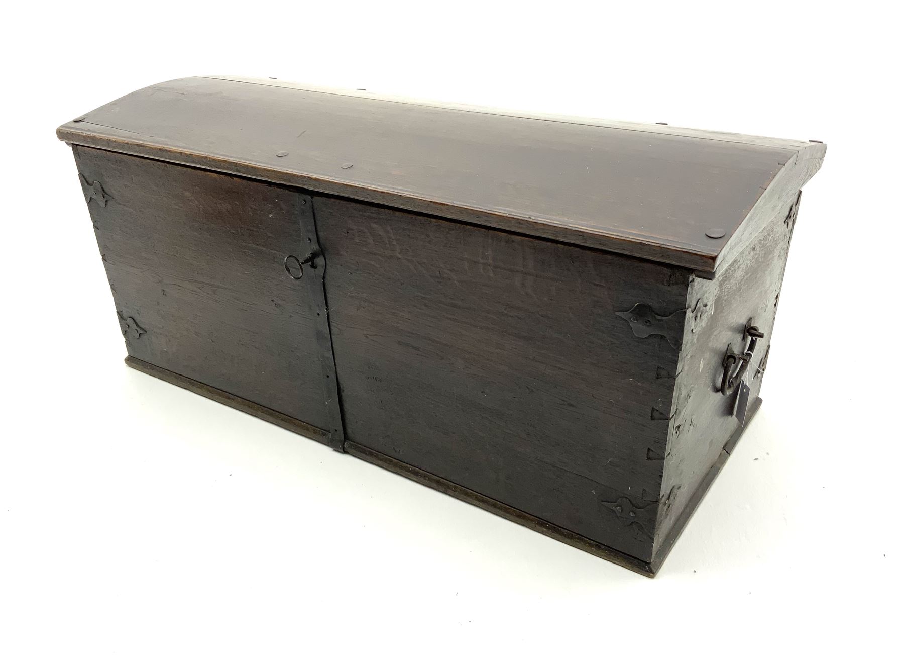18th century large oak domed trunk, hinge lid enclosing interior, fitted with cast iron handles and joints 