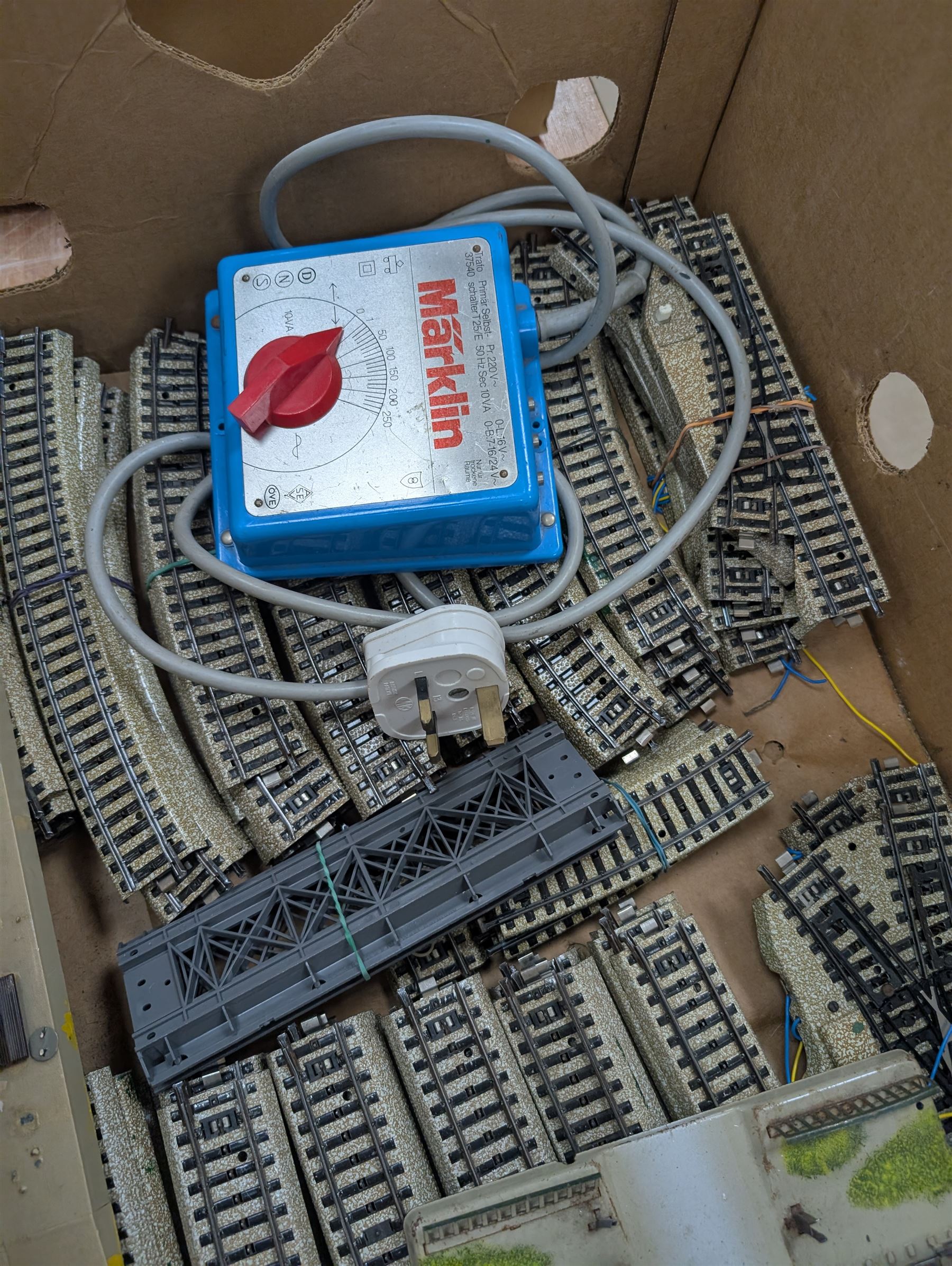 Marklin HO gauge model railway, comprising two Marklin H0 gauge locomotives, including electric DB class example and a steam locomotive, controller, tin plate track and rolling stock