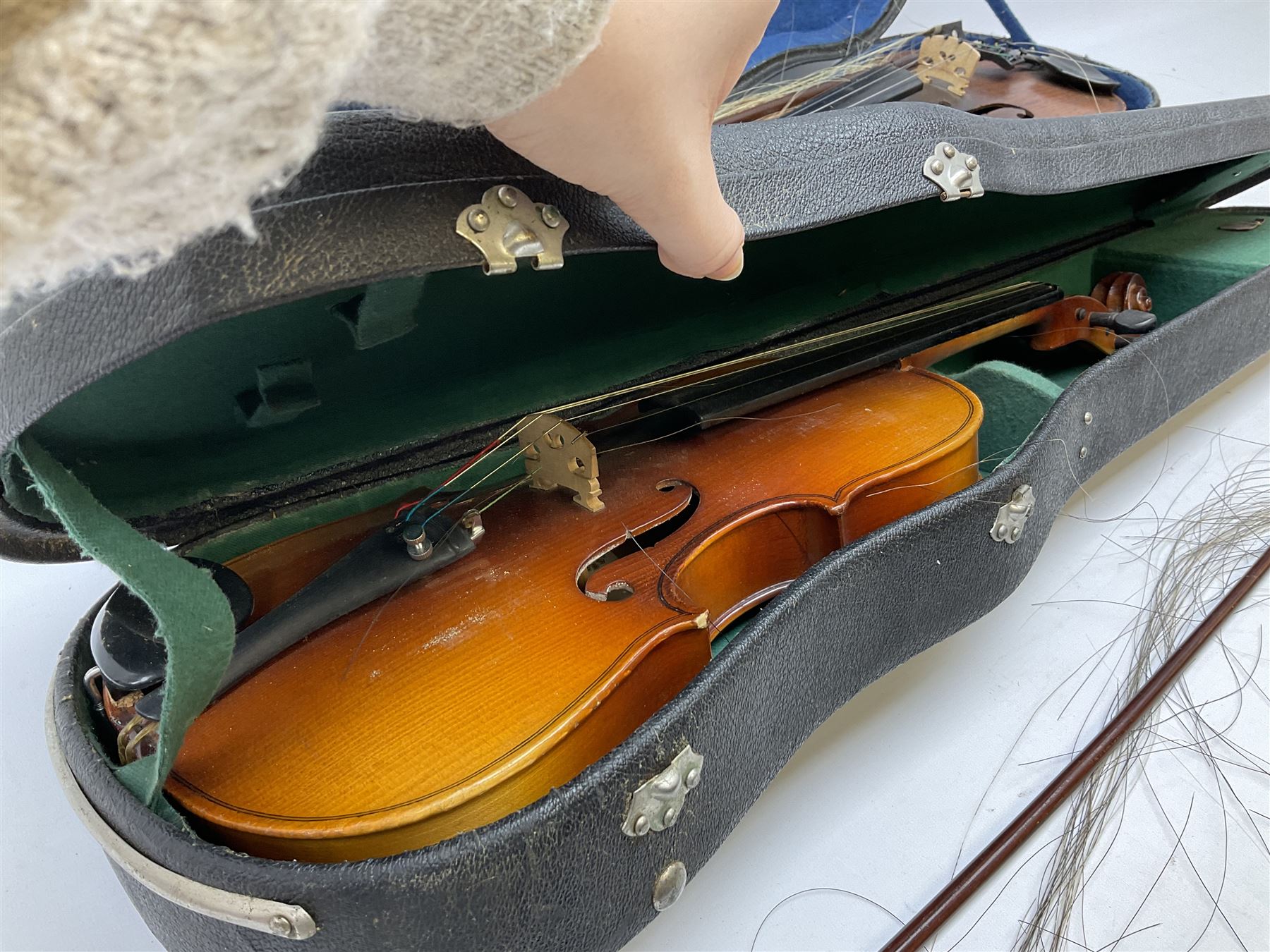 Two cased Skylark violins with bows, largest violin L59cm 