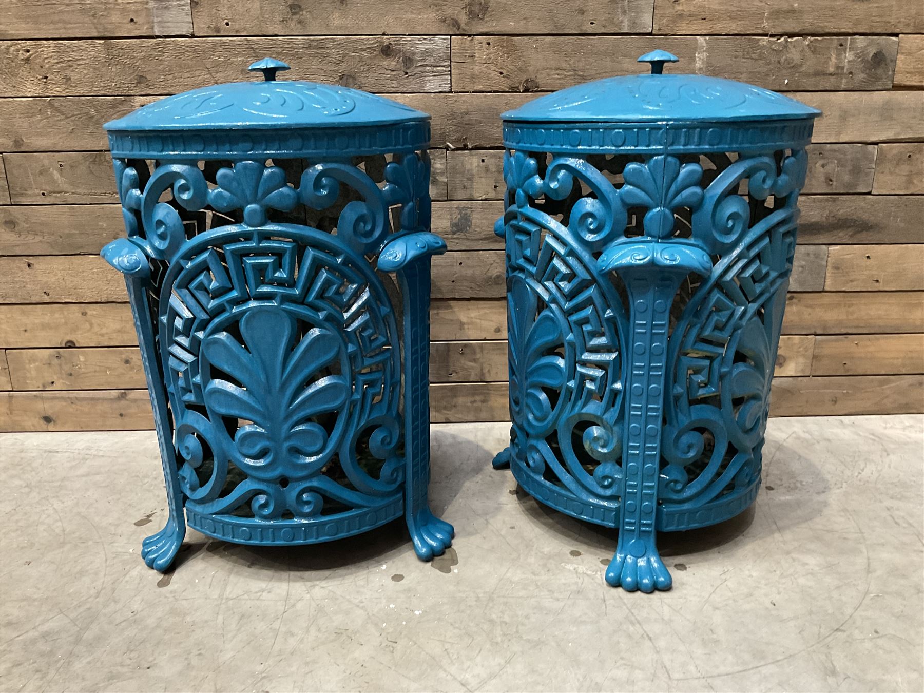 Pair of blue painted cast iron garden bins
