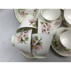 Royal Doulton Apple Blossom pattern tea service for twelve, comprising twelve saucers, twelve tea plates, twelve teacups, milk jug, sucrier and two cake plates