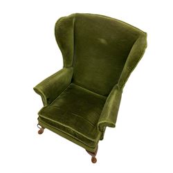 Parker Knoll wing back armchair, upholstered in green fabric