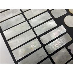 Collection of fifty seven Chinese mother of pearl gaming counters or tokens, of various size and form including rectangular, circular and fish shaped examples, various decoration including floral motifs, largest rectangular examples L6cm