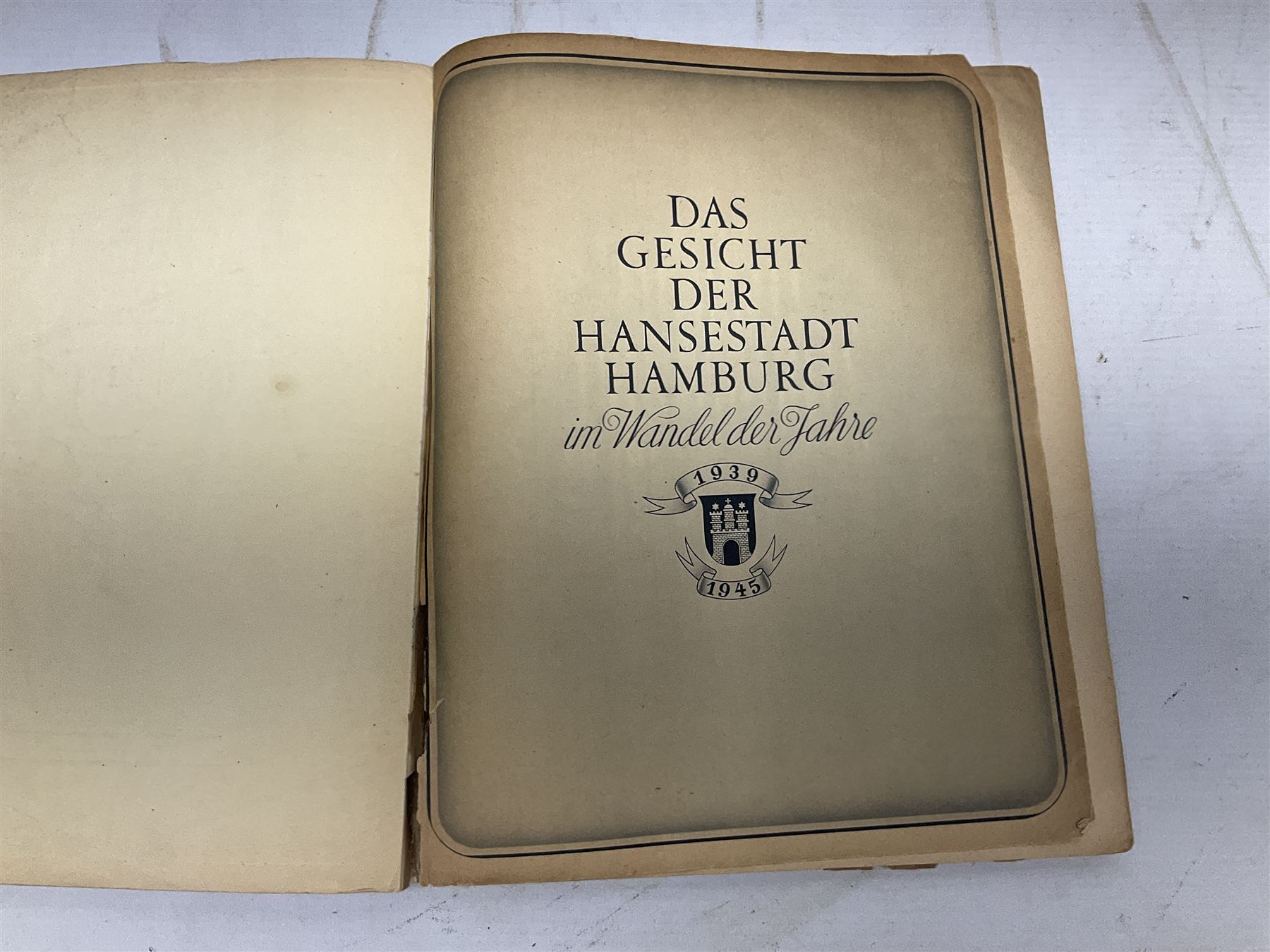 Adolf Hitler, Bilder aus dem Leben des Fuhrers [Pictures from the Life of the Fuhrer], Herausgegeben vom Cigaretten / Bilderdienst, Hamburg / Bahrenfeld, 1936, an album of two hundred tipped-in cards bearing photographs by Heinrich Hoffman, originally collected with cigarettes, 31 cm x 24 cm; together with a Waffen-SS book 'Wenn alle Bruder schweigen'; Hamburg 1939-1945; and two other booklets