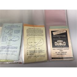 Modern loose leaf binder containing over sixty 1940s - 1960s Hornby Dublo booklets and paper ephemera for Railway Layout Suggestions, Locomotive Instructions, Accessories Instructions, price lists, toy shop receipts, Hornby Railway Company publications etc