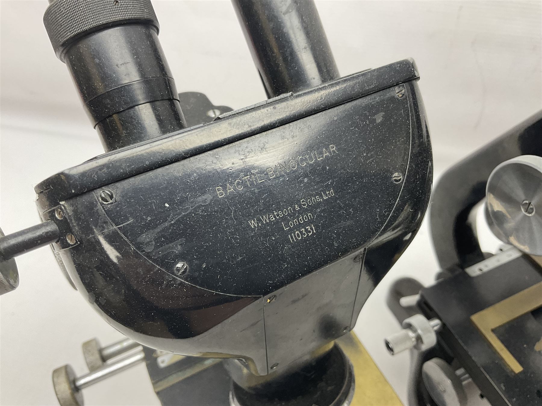 Three Binocular microscopes, comprising two W. Watson & Sons Bactil no 110331 and 107773 and Tasco LMSQF-F