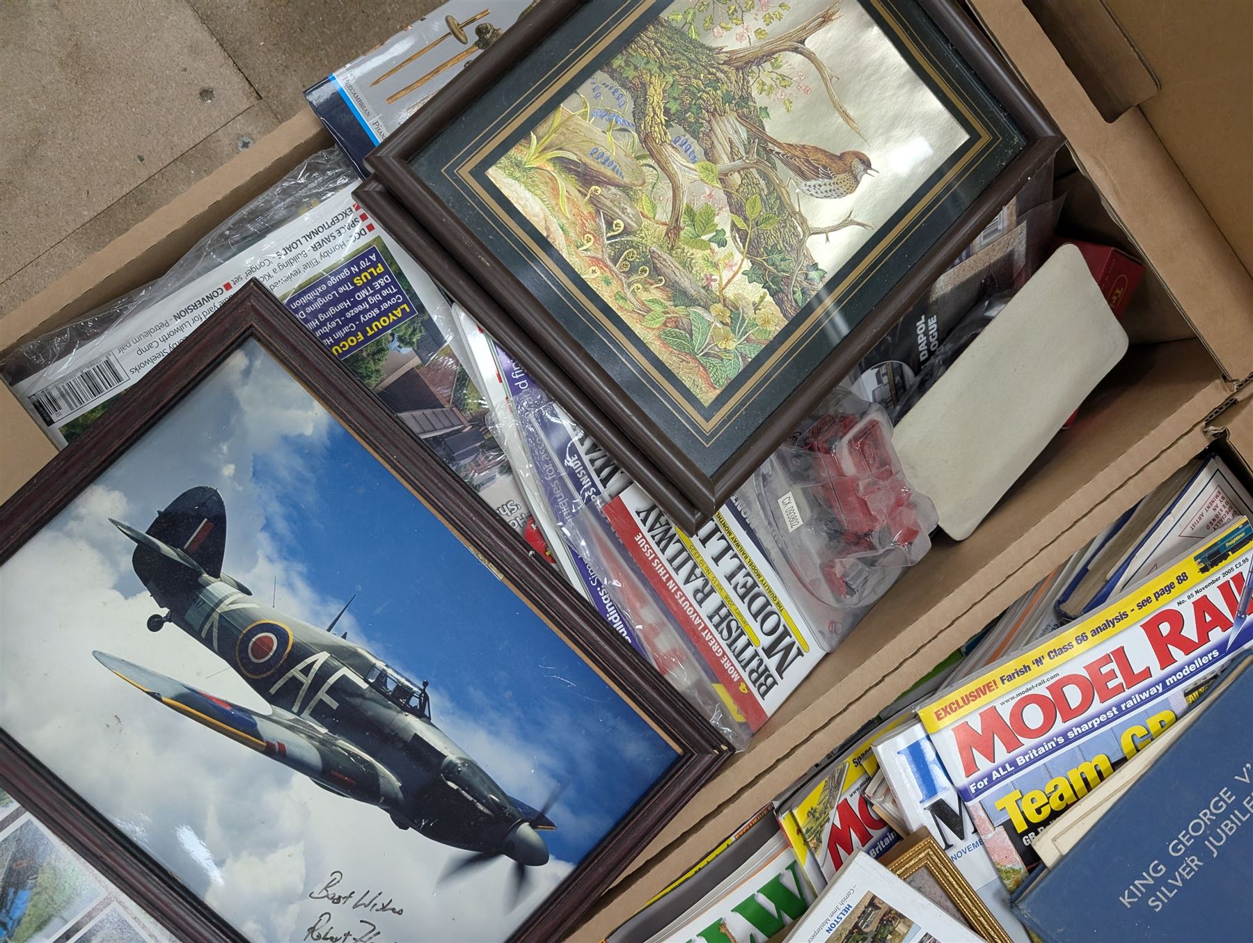 Large collection of model railway magazines, including Railyway Modeller, British Railway Modelling and Model Rail, together with railway and similar reference books, childrens books and VHS tapes in eleven boxes