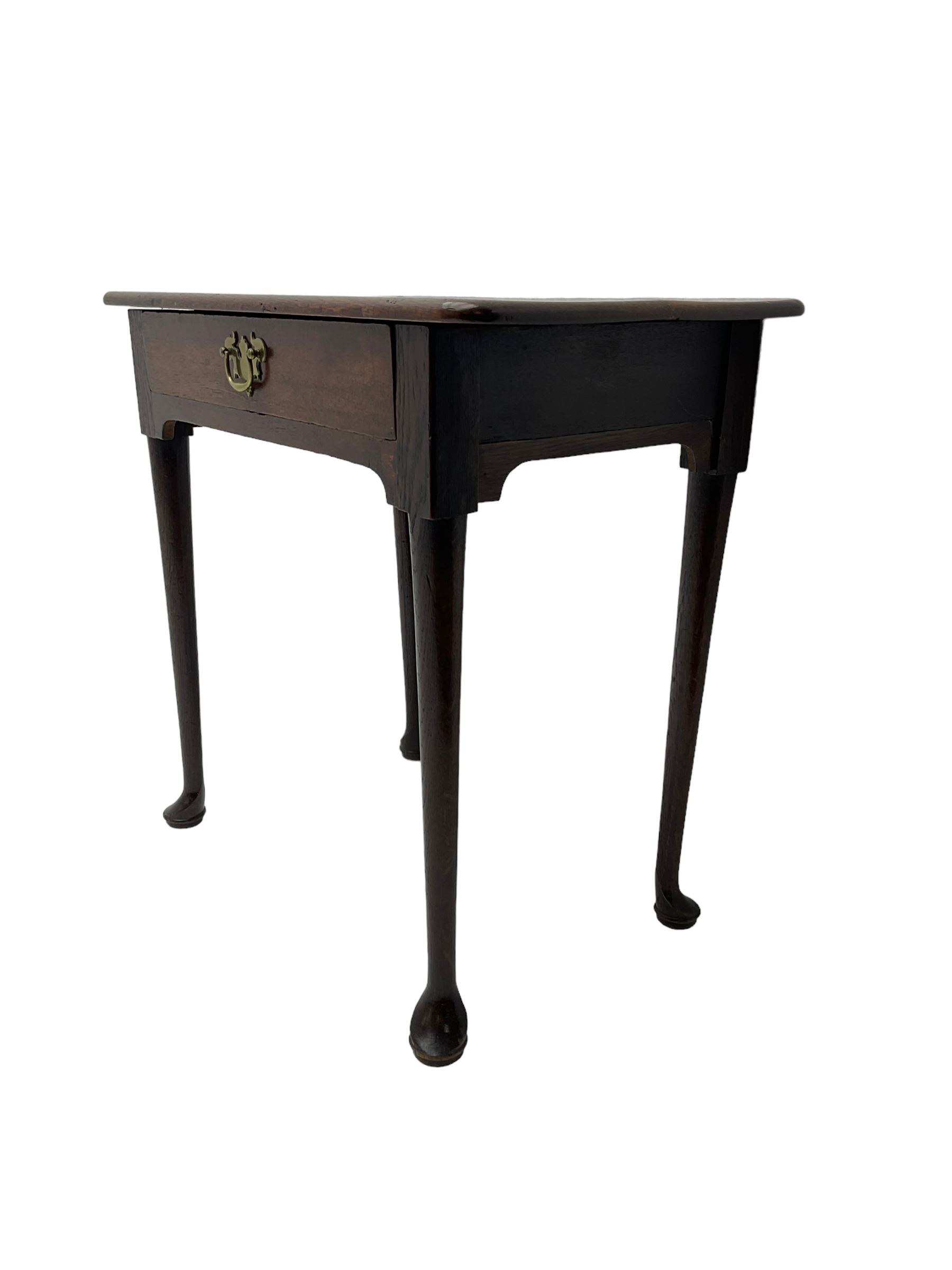 George III oak low boy, fitted with single drawer, raised on tapered supports with pad feet