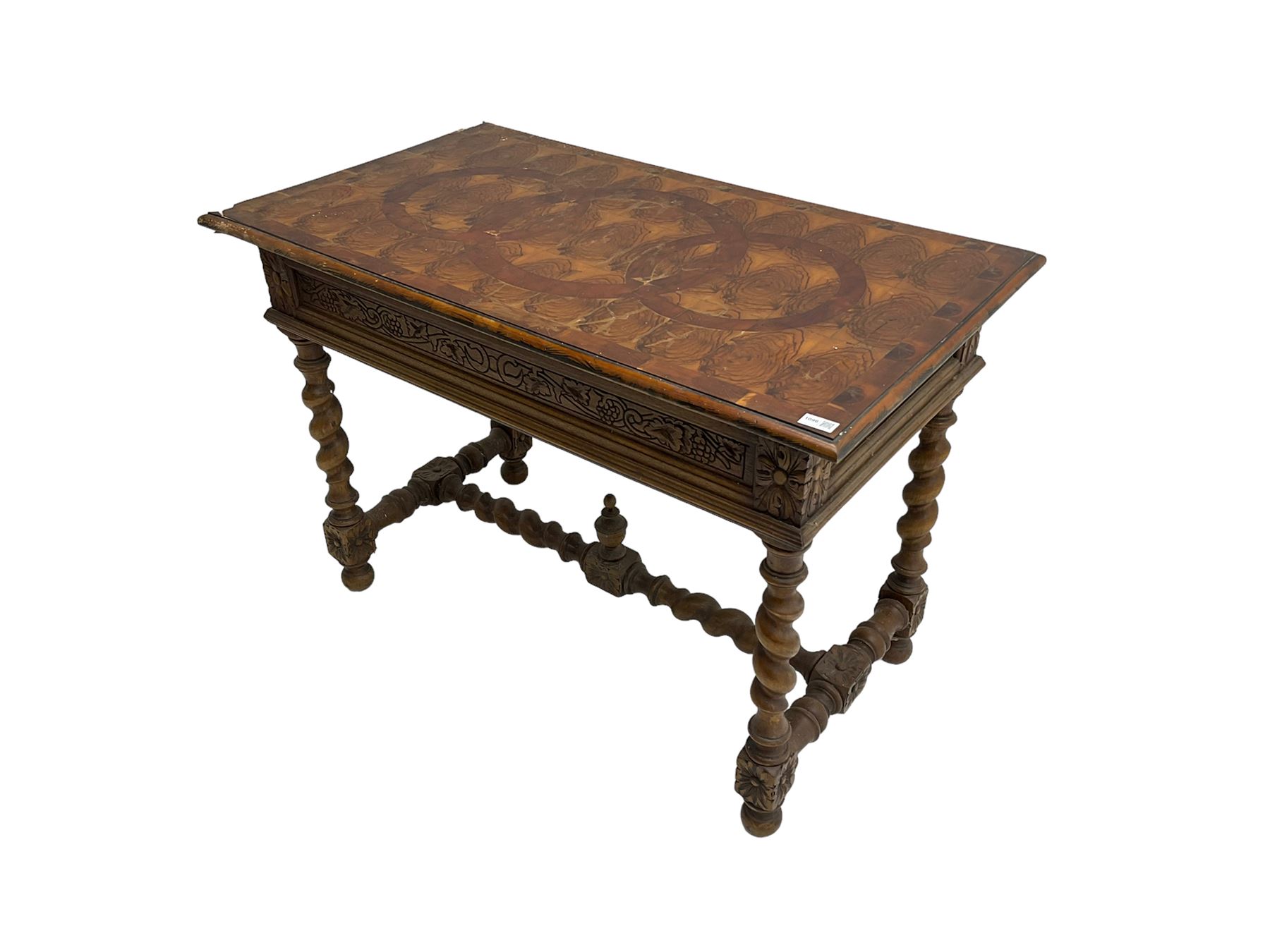 Early 20th century carved oak side table, the rectangular top with cross section inlay, frieze carved with foliate decoration, raised on spiral turned supports united by barley-twist stretcher with finial