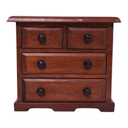 Table top chest of draws, fitted with three draws, upon a skirt base, together with another table top chest 