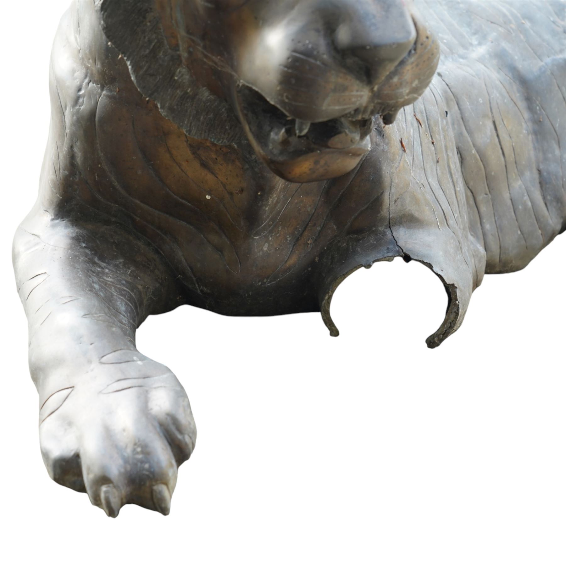 Pair of Chinese cast bronze tiger figures, one in a seated resting pose and the other advancing with open mouth, both with incised striping and aged bronze patina
Seated tiger (H 54cm, W 63cm, L 129cm)
Stood tiger (H 76cm, W 40cm, L 176cm) 