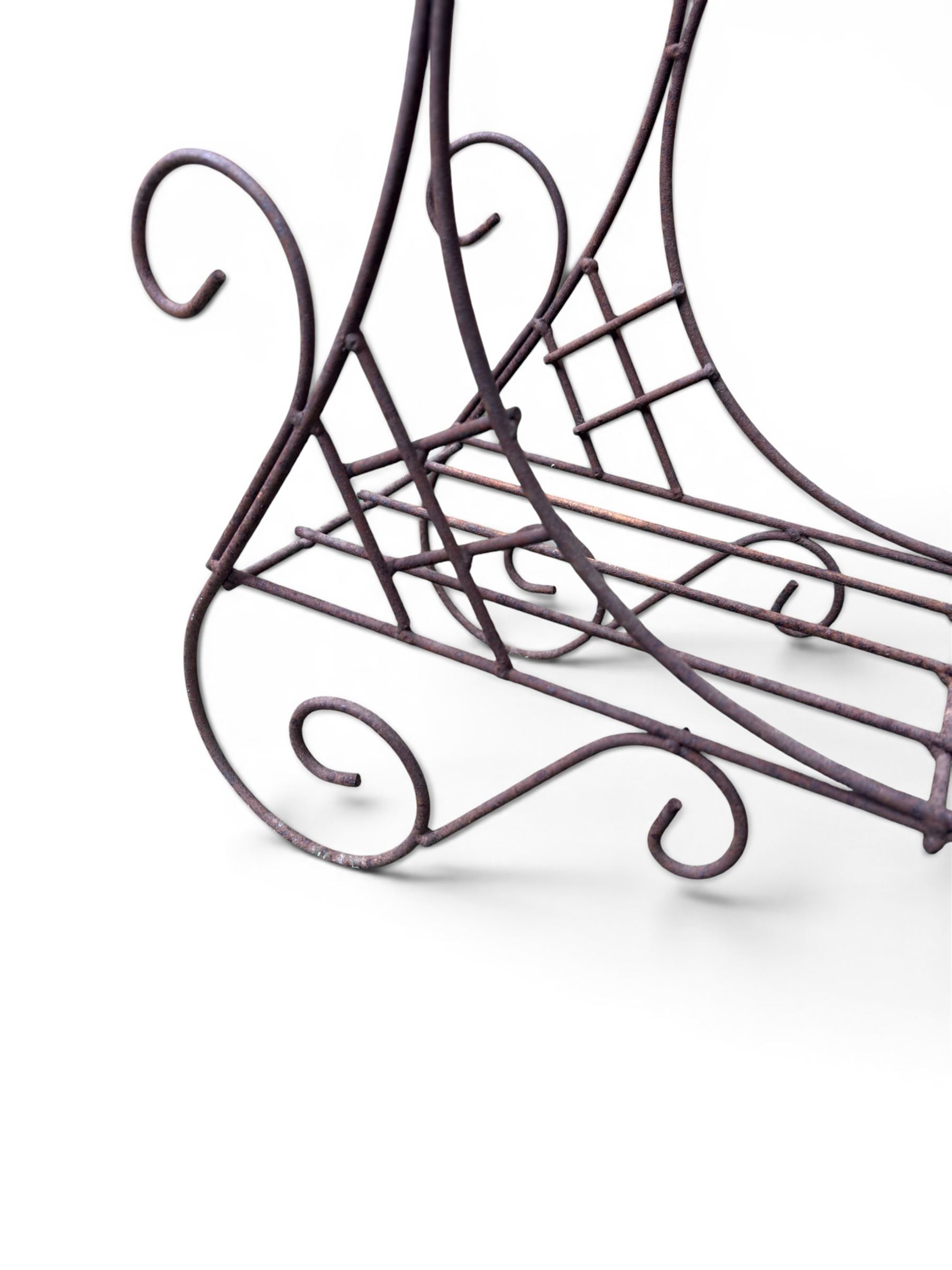 Mid-20th century wirework garden planter, oval form with heart shaped centre, under-tier shelf above scrolling feet