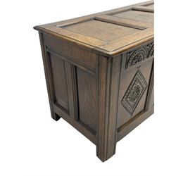 18th century oak coffer or chest, rectangular triple panelled hinged top with moulded edge enclosing main compartment and candle box, the frieze carved with repeating concentric lunettes and foliate patterns, the front fielded panels decorated with lozenges containing central flower heads, on stile supports