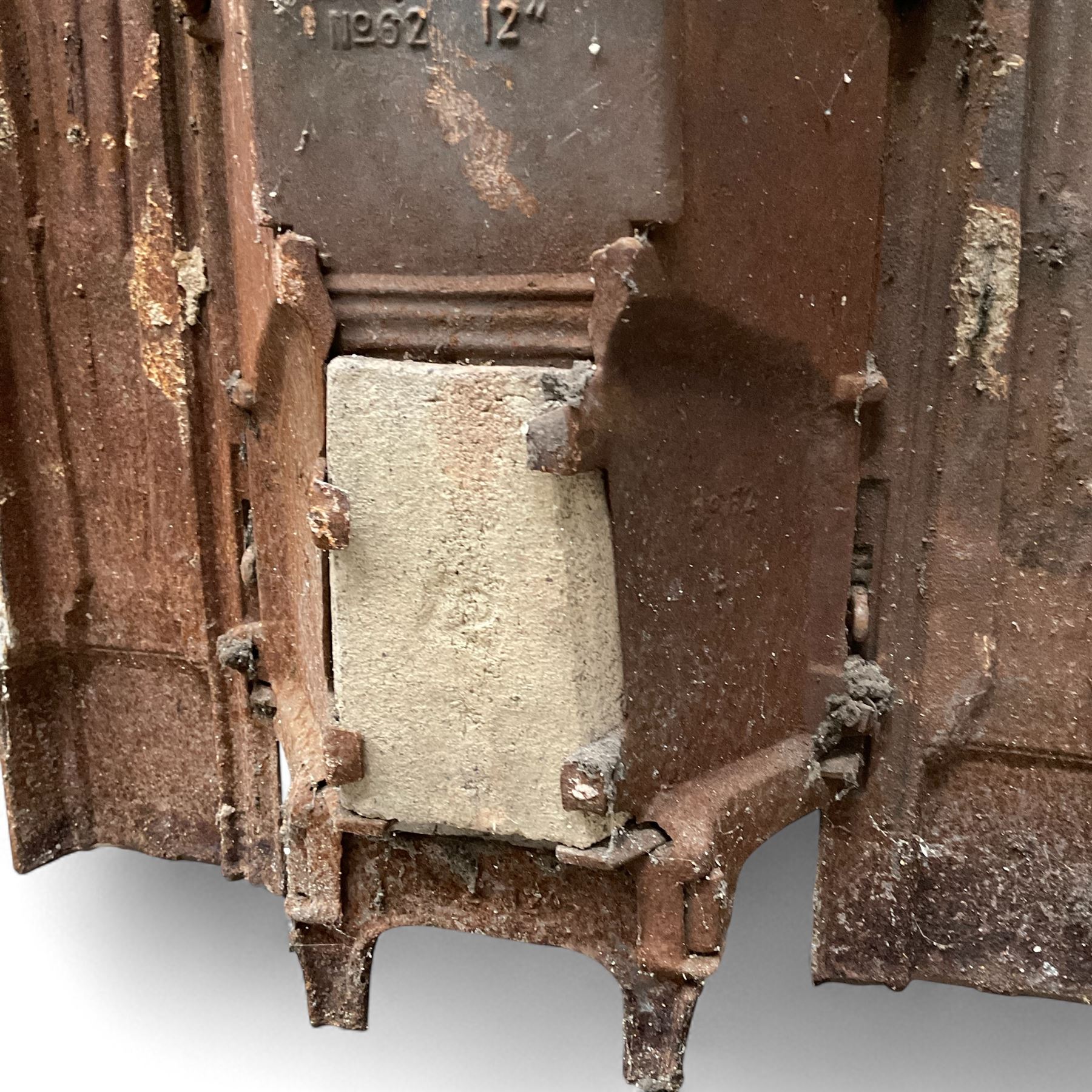 Two Victorian small cast iron fireplaces in a white finish