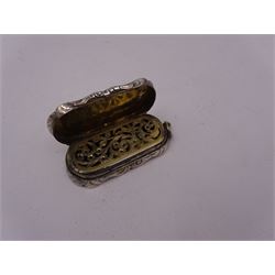 Victorian silver vinaigrette, of oval form with shaped rim, with engraved scrolling and foliate decoration and cartouche with initials, with foliate pierced gilt interior, hallmarked David Pettifer, Birmingham 1855, L4.3cm