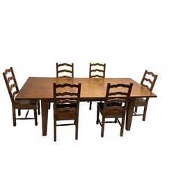 Late 20th century stained pine extending dining table with additional leaf, rectangular top over square tapering supports, and set six stained pine dining chairs with shaped ladder backs and dished seats