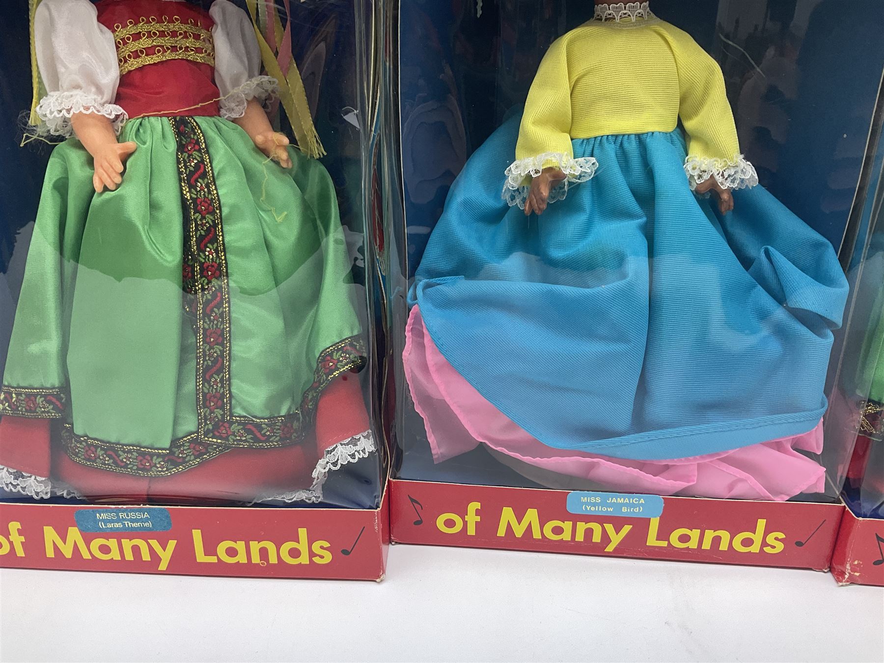 Four Mayfair Products Musical Dolls of Many Lands; original boxes and delivery boxes; and set of twelve Nationality Dolls with Sleeping Eyes; boxed (16)