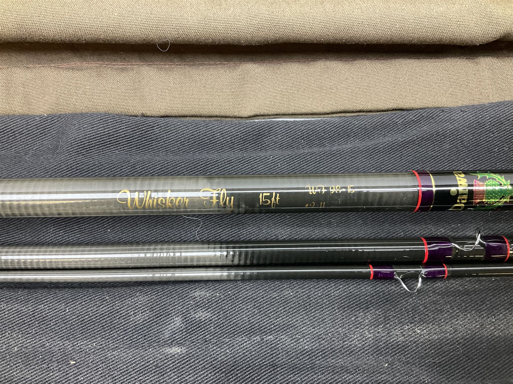 Twelve carbon fiber fishing rods in cloth covers, to include Normark fishing rod, Daiwa Carbon C98 etc (12)