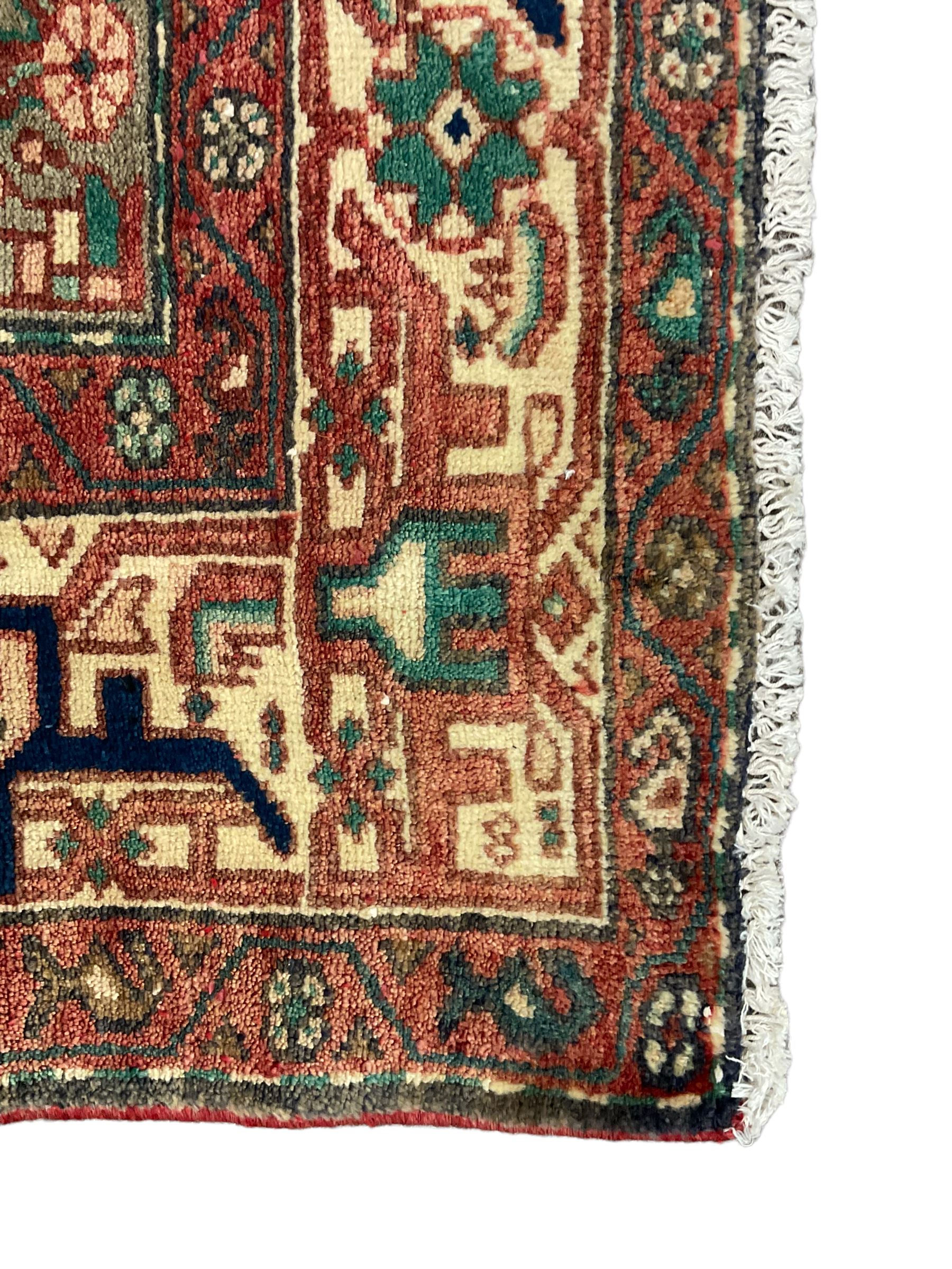 Persian Malayer rug, the field decorated with tree of life, floral, animal and bird motifs, surrounded by three band border with geometric design