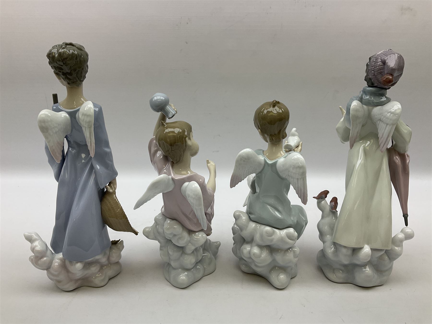 Lladro Season Angels set, comprising Spring Angel no 6146, Fall Angel no 6147, Summer Angel no 6148 and Winter Angel no 6149, all with original boxes, largest example 29cm