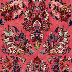 Persian rose ground runner rug, the field decorated with repeating polychrome floral sprays and scrolling palmettes, enclosed by an ivory floral border and narrow navy geometric guard stripes