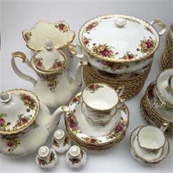 A Royal Albert Old Country Roses tea and dinner services, comprising seventeen dinner plates, seventeen dessert plates, sixteen side plates, fourteen twin handled soup bowls, twelve soup bowl saucers, seven bowls, five further bowls,  five tureen and covers, a gravy boat and stand, three cruets, tea pot, coffee pot, fifteen tea cups, seventeen teacups saucers, eleven coffee cups, nine coffee cup saucers, two further saucers, open sucrier, milk jug, two pin dishes, two ash trays, a tray and a jardiniere. 