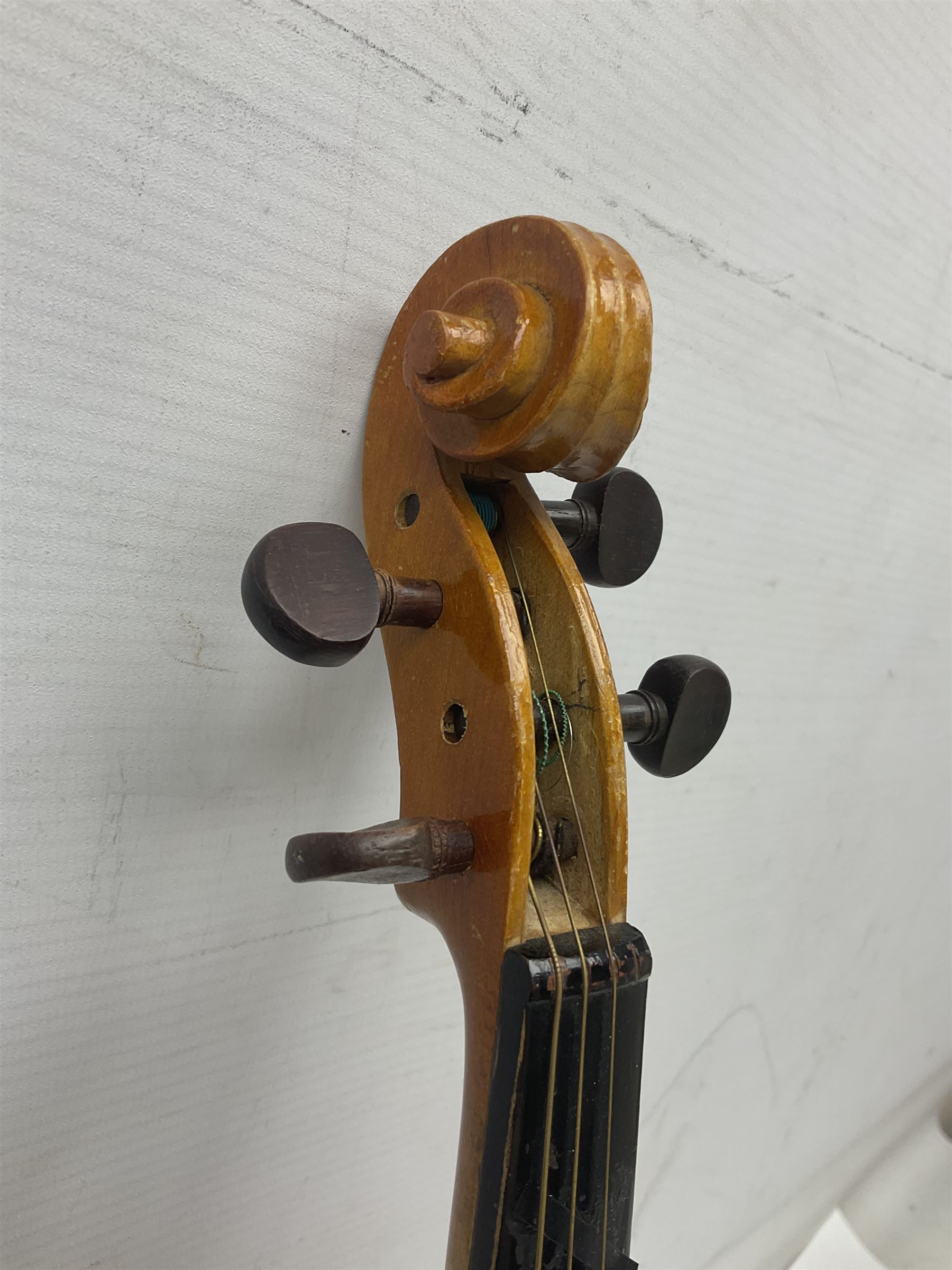 Four Chinese graduated violins - full size with 35.5cm two-piece back; three-quarter size with 33.5cm two-piece back; half size with 31cm two-piece back; and quarter size with 27.5cm two-piece back; all cased except full size; one with bow (4)